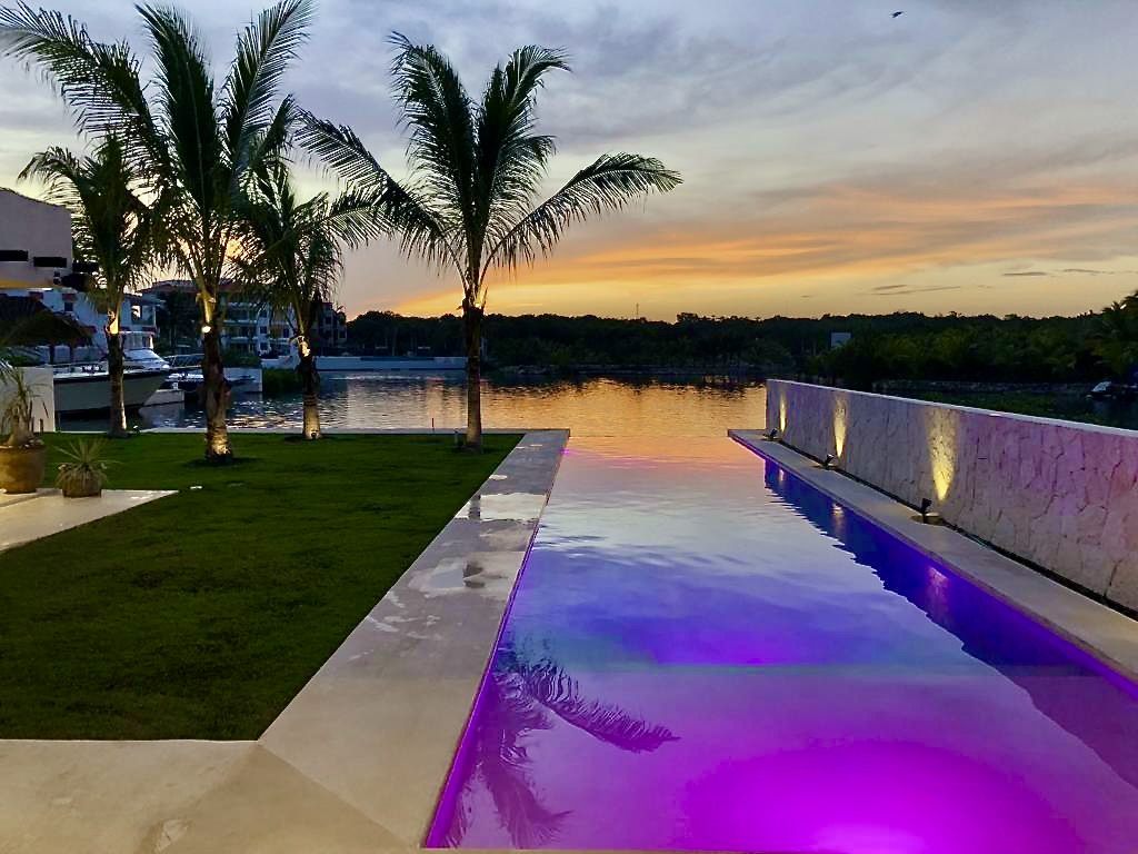 Pool with lights at sunset